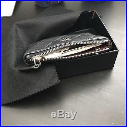 Chanel Black lambskin with silver hardware key holder/wallet/zip pouch