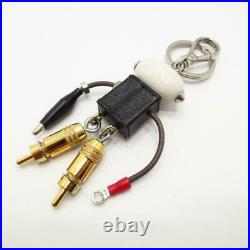 Prada Keychain Charm Robot Metal plastic leather Black Gold Bag accessories